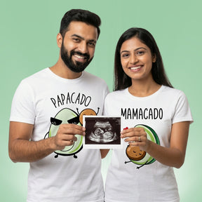 Mamacado Papacado pregnancy announcement couple t-shirts — Indian couple holding baby sonography scan in white tees
